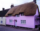 Rethatched terraced cottage in combed wheat reed, Maiden Newton Dorset
